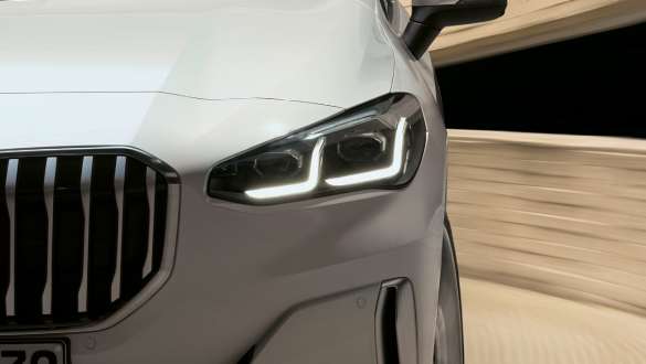 BMW 2 Series Active Tourer with LED headlights U06 2021 close-up front BMW 2 Series Active Tourer with LED headlights U06 2021 Mineral White metallic close-up front