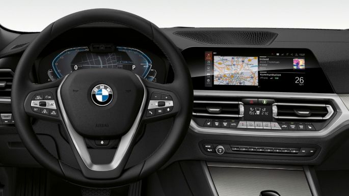 BMW 3 Series Sedan, 330e Cockpit. Detailed frontal view of the BMW 3 Series Sedan cockpit with i-specific display.