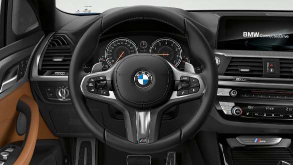 BMW X3 M40i and BMW X3 M40d, M leather steering wheel. BMW X3 M40i and BMW X3 M40d, interior, cockpit with M leather steering wheel.