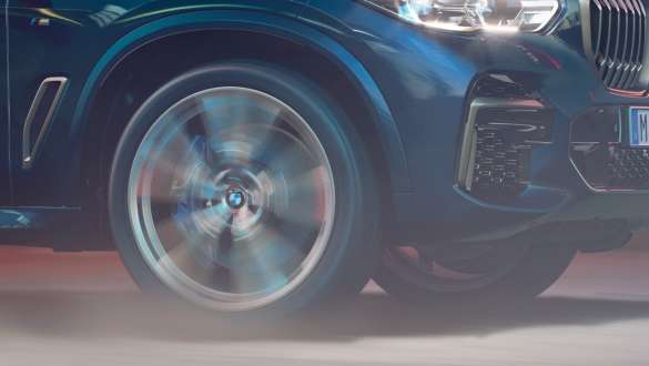 BMW X5 M50i and M50d with Adaptive M suspension G05 BMW X5 M50i and M50d with Adaptive M suspension Carbon black metallic G05 2018 SUV close-up wheel
