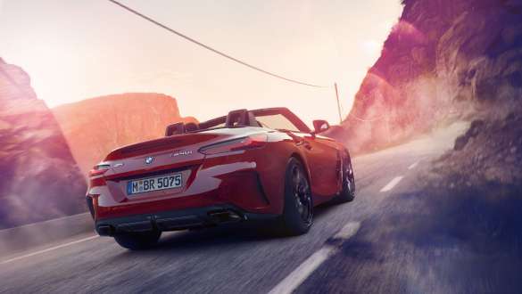 BMW Z4 Roadster variable sport steering Driving BMW Z4 Roadster from behind in the mountains