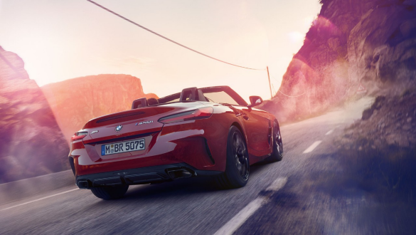 BMW Z4 Roadster variable sport steering Driving BMW Z4 Roadster from behind in the mountains