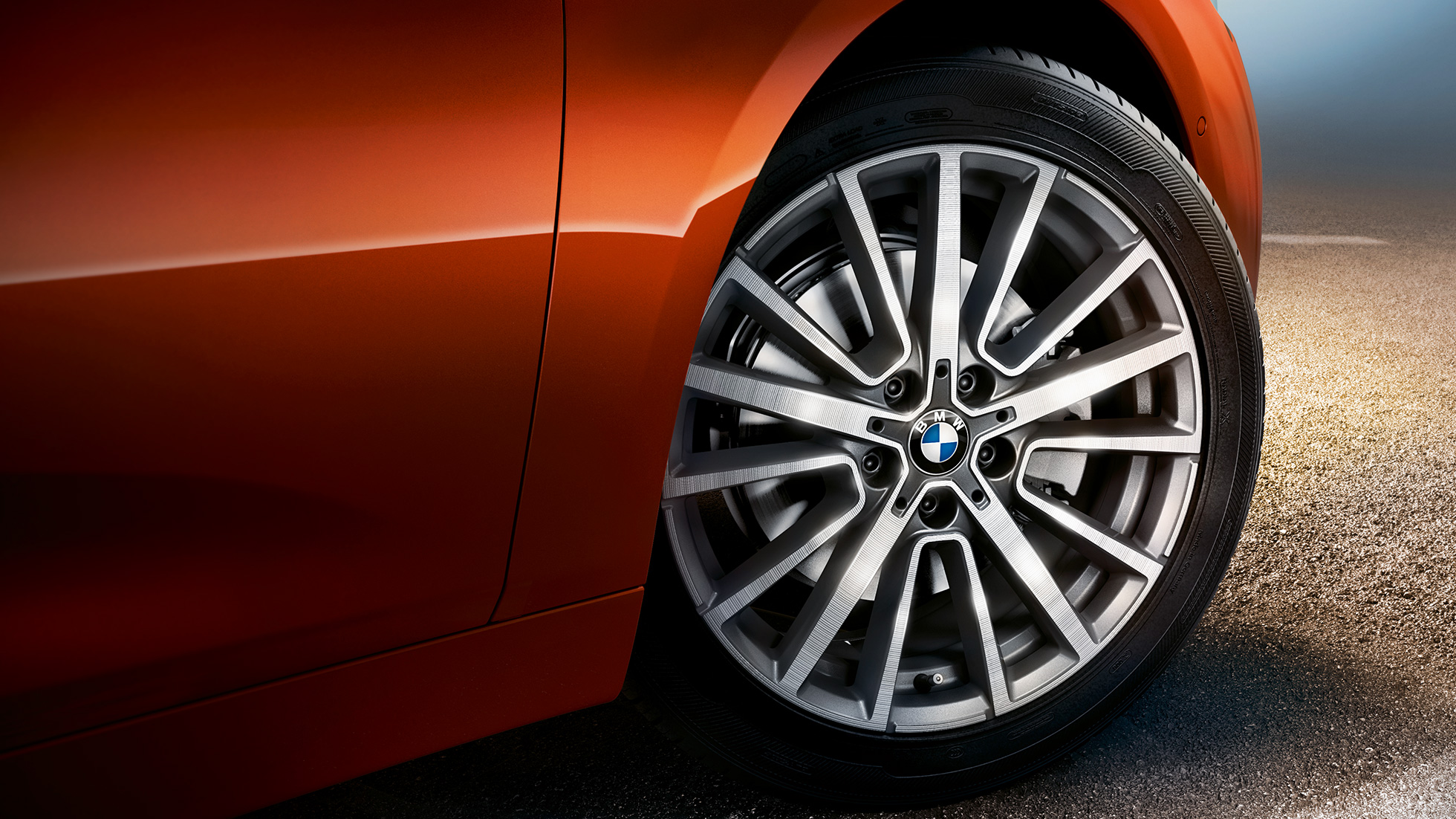 Alloy wheel BMW 2 Series Active Tourer Alloy wheel BMW 2 Series Active Tourer F45 Facelift 2018 Sunset Orange metallic close-up wheel