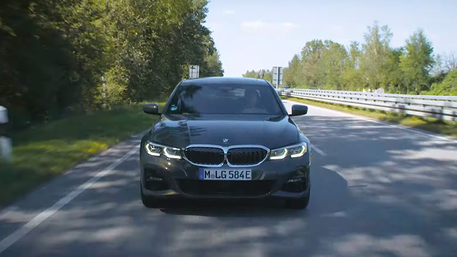 BMW plug-in hybrid driving on the street BMW 5 Series Sedan G30 BMW plug-in hybrid driving on the street front view