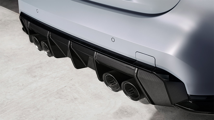 BMW M4 CSL G82 BMW Individual Frozen Brooklyn Grey metallic Titanium exhaust system with tailpipes in Black matt close-up rear view