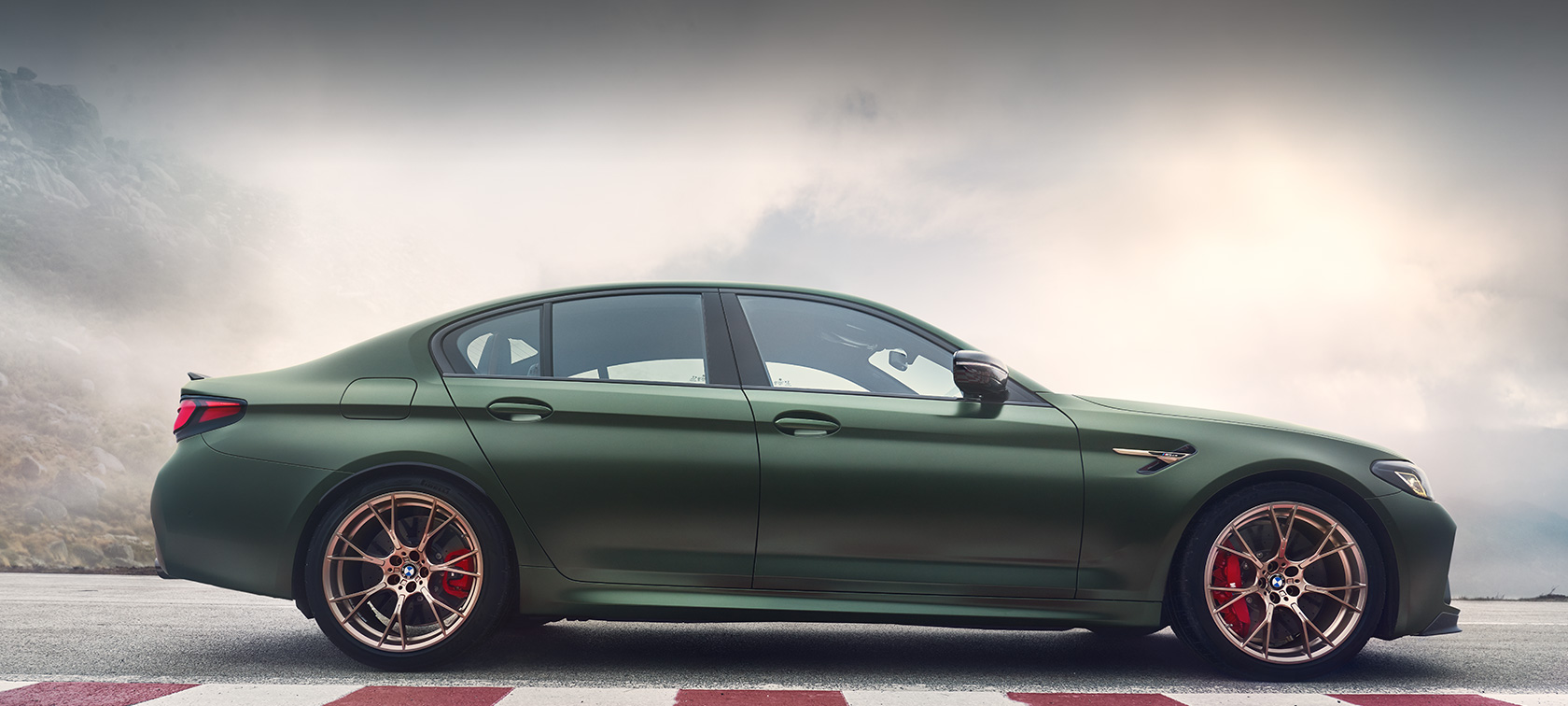 BMW M5 CS F90 2021 Frozen Deep Green metallic three-quarter front view BMW M5 CS F90 2021 Frozen Deep Green metallic three-quarter front view