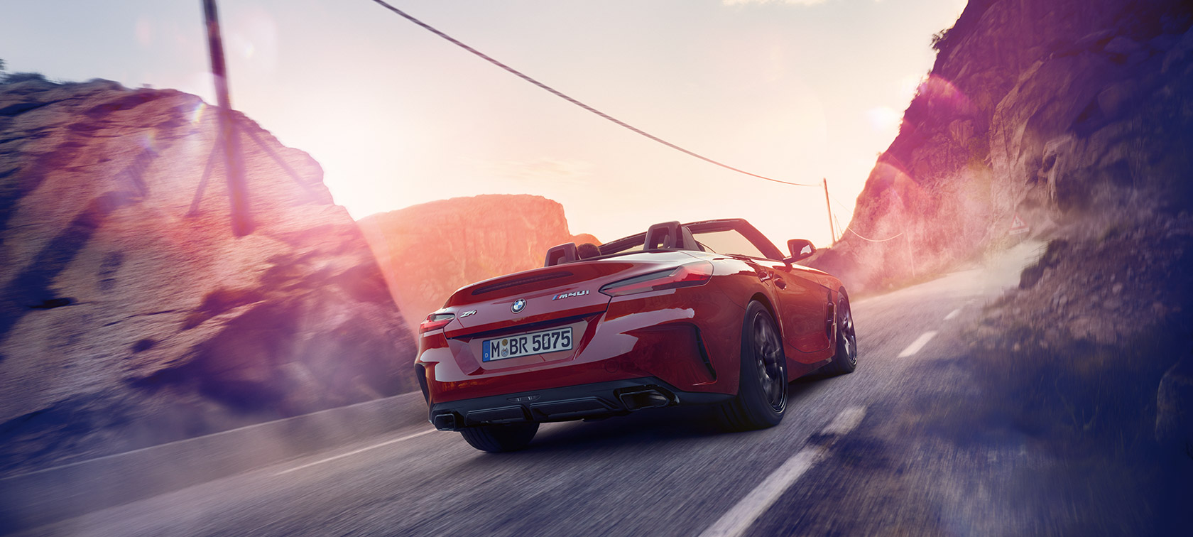 BMW Z4 Roadster driving through mountains BMW Z4 Roadster driving through mountains