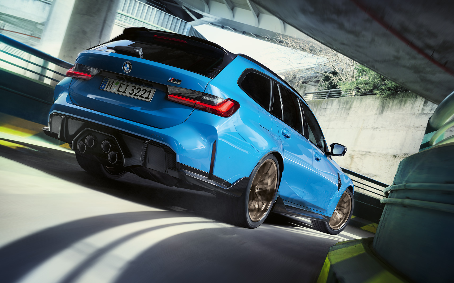 BMW M3 Touring G81 BMW M Performance Parts three-quarter rear view BMW M3 Touring G81 BMW M Performance Parts three-quarter rear view driving
