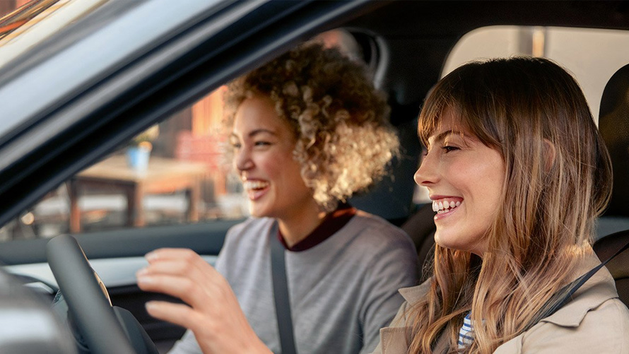 BMW driving pleasure with BMW Service Two happy women in their BMW